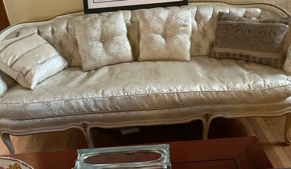 French Provincial camelback sofa in ivory embroidered silk